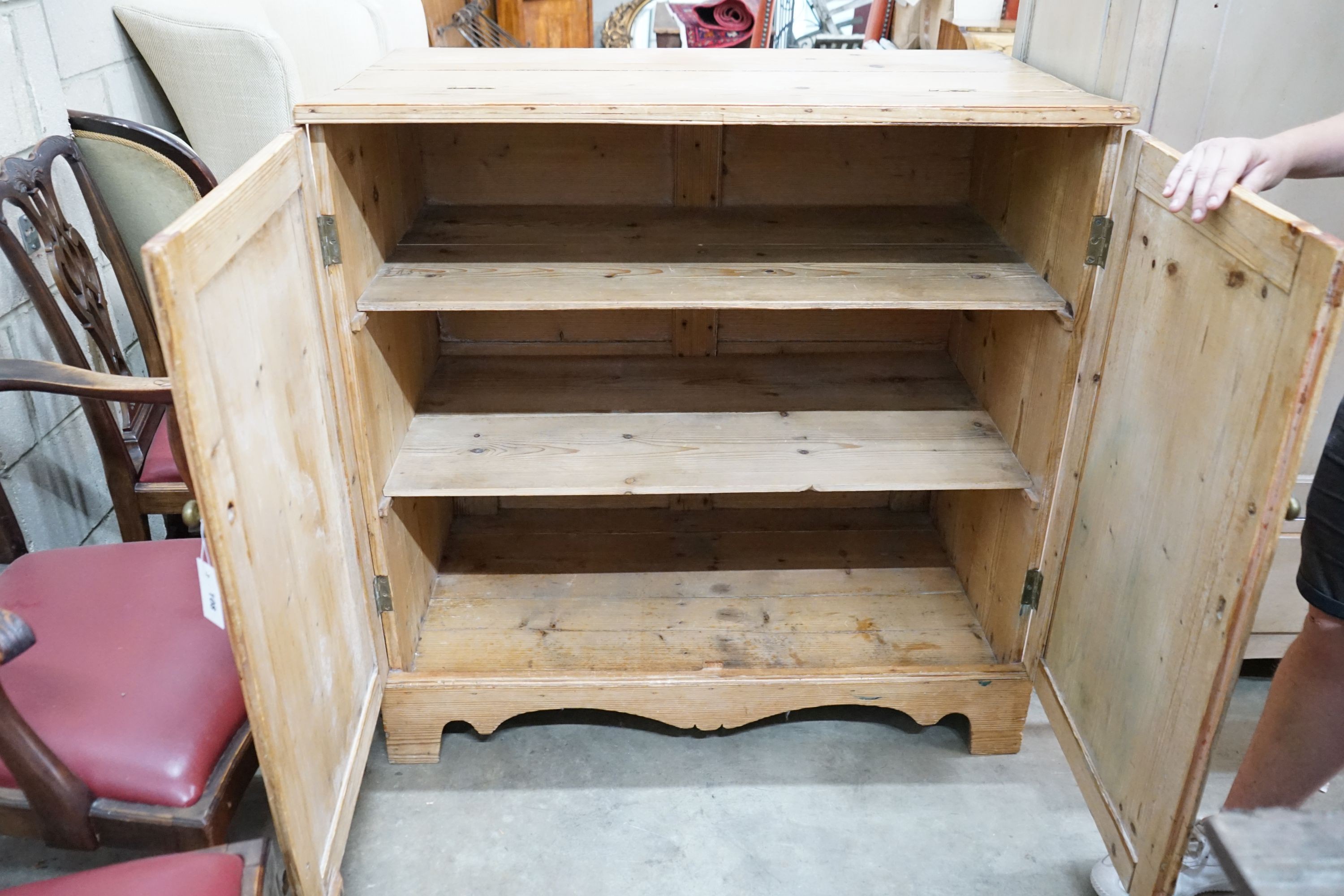 A 19th century pine part hinged top press cupboard, length 107cm, depth 61cm